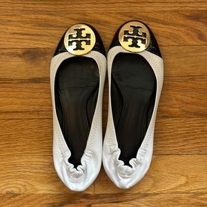 Tory Burch Reva black & white ballet slip ons with a beautiful gold logo